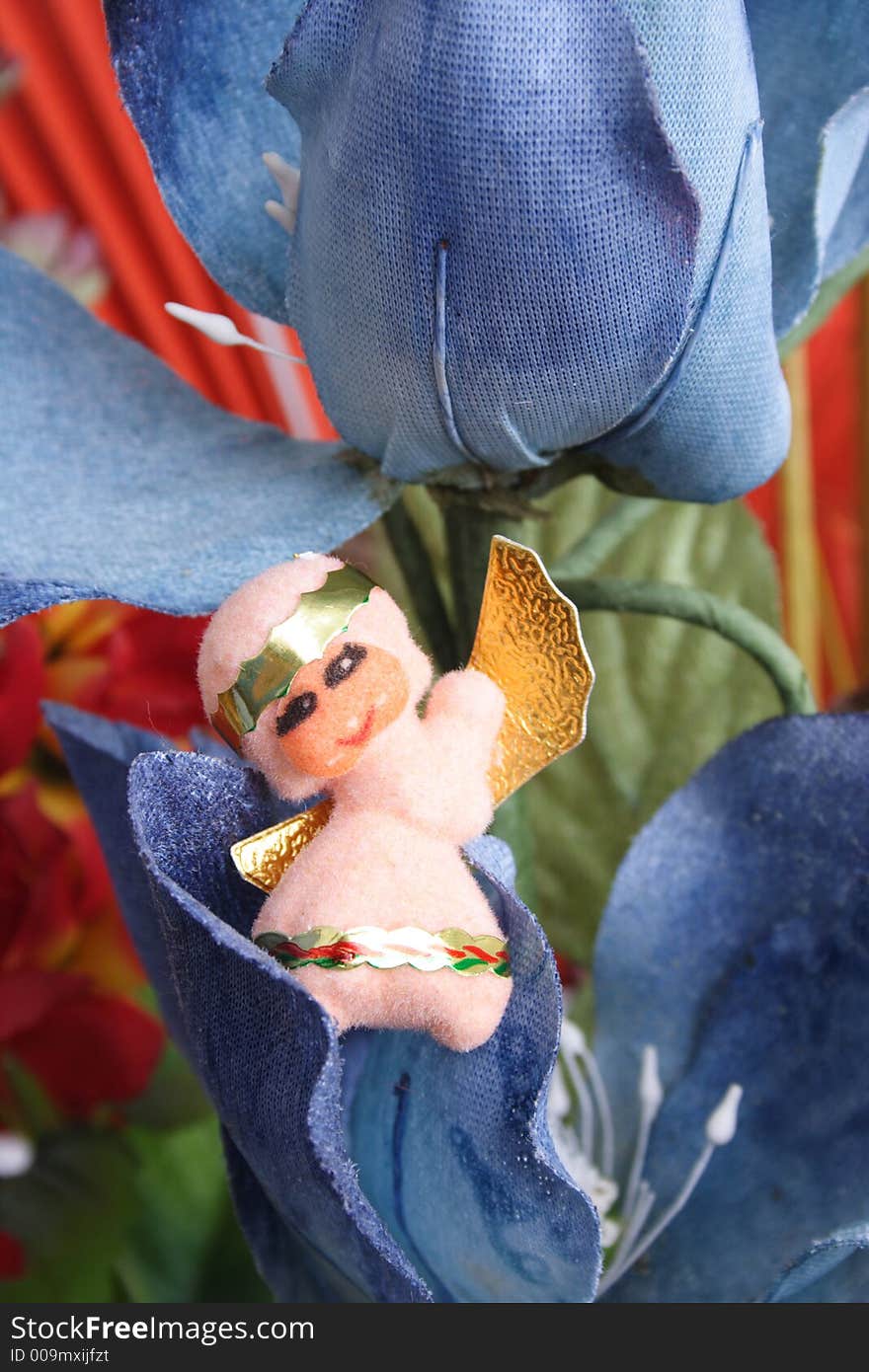 Little angel on  a blue flower. Little angel on  a blue flower