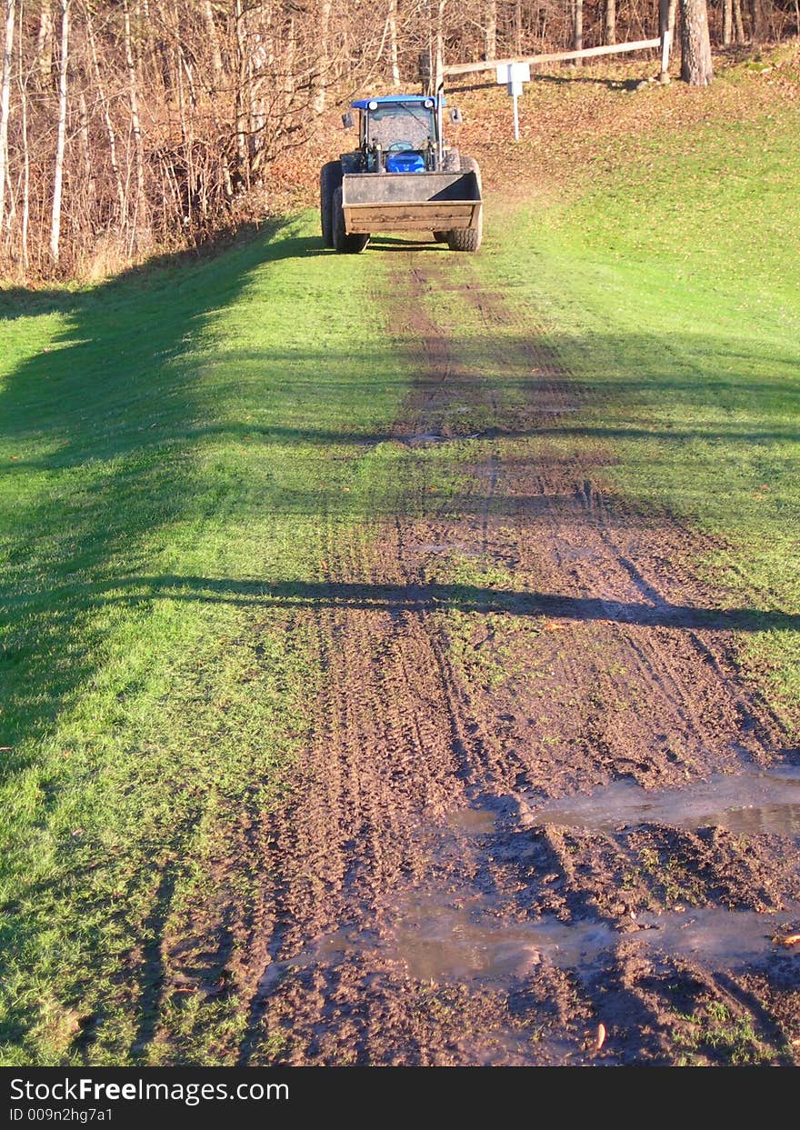 Tractor on a field in the fall.