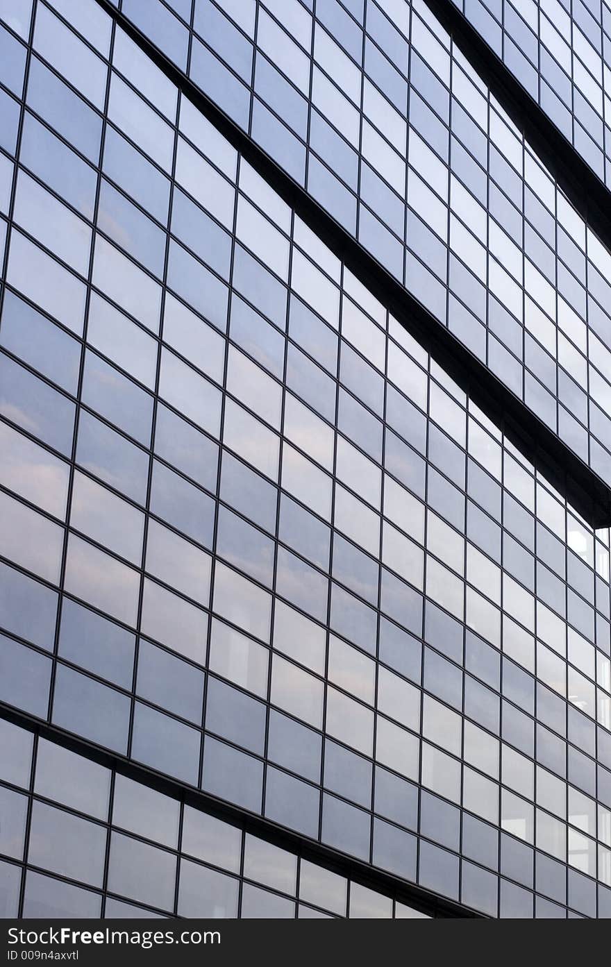 Abstract reflecting windows on large business building