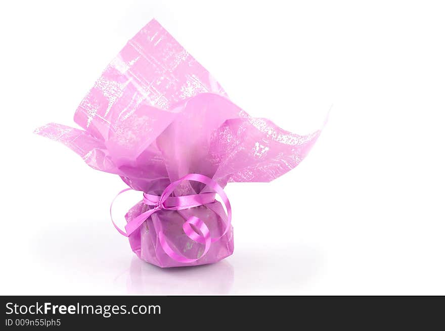 Pink present package against white background, isolated. Pink present package against white background, isolated