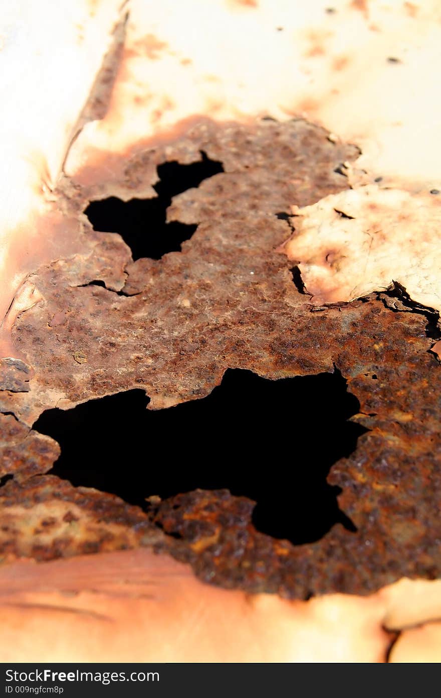 Black hole in rusty metal surface