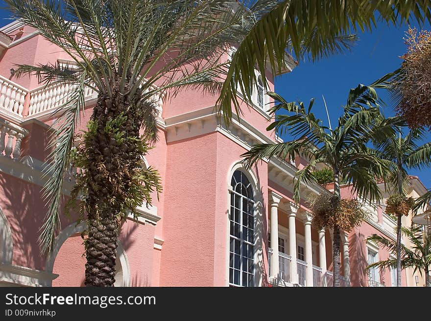 Spanish Architecture Against Blue Sky with Palm Trees