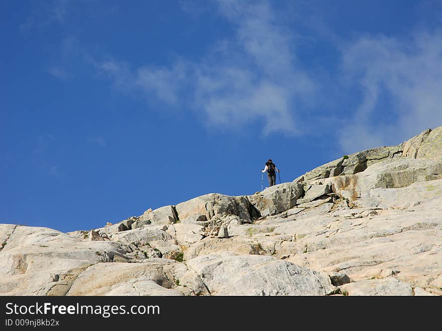 A trekker girl through the Mulleres valley, Pirineos, Spain. A trekker girl through the Mulleres valley, Pirineos, Spain