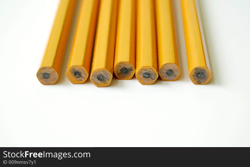 Row of number two pencils on a white background. Row of number two pencils on a white background