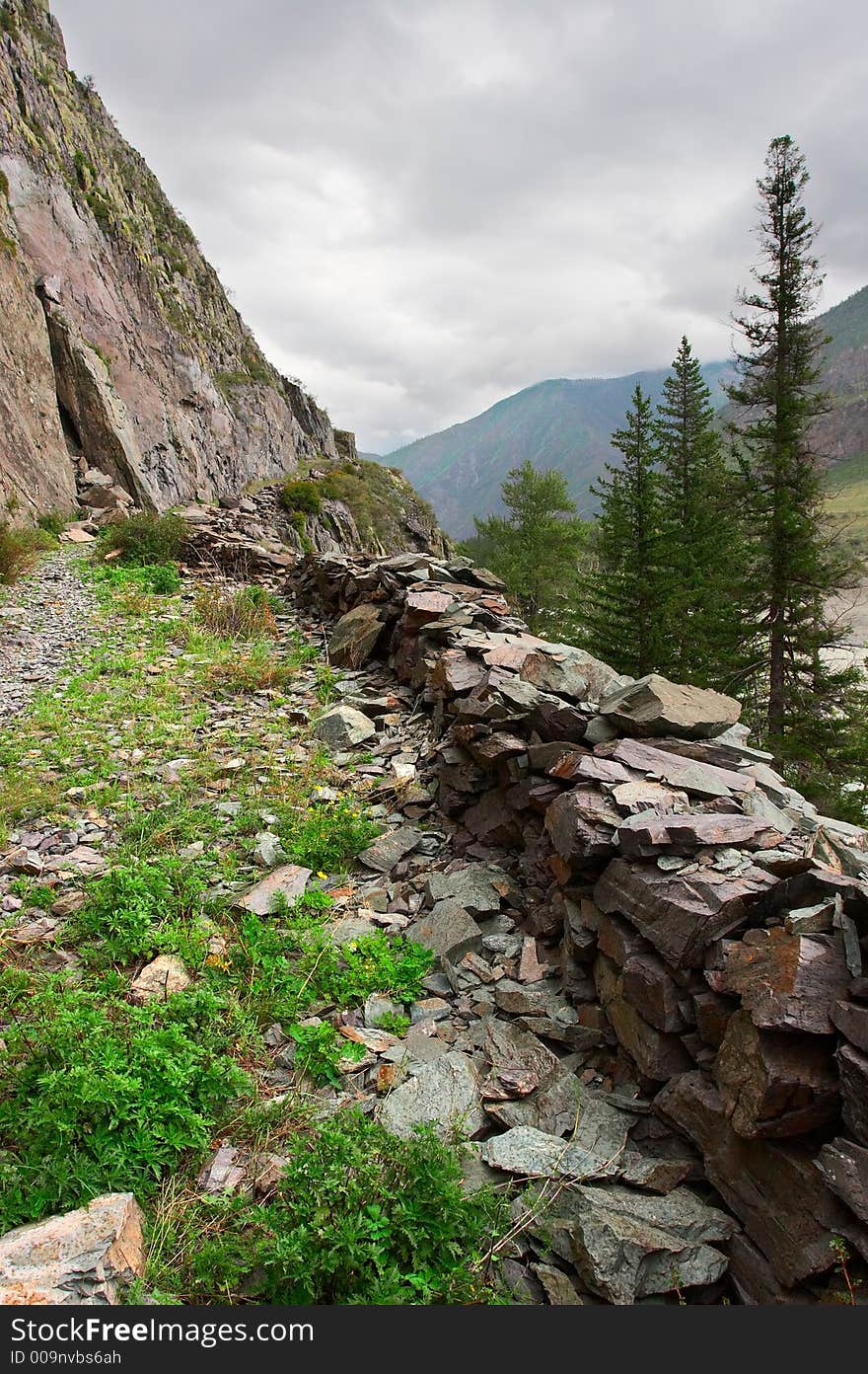 Road, mountains and clouds. Altay. Russia.