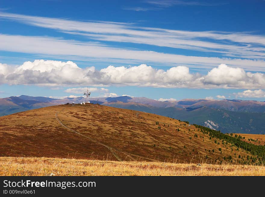 Blue sky, clouds and mountains.