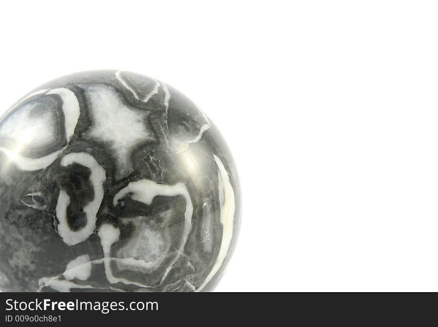 Stone ball against a white background