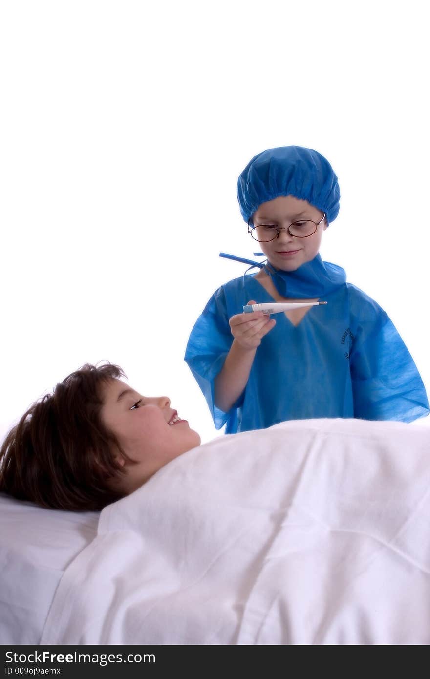 Young doctor, dressed in scrubs, taking the temperature of his patient. Isolated against a white backdrop.