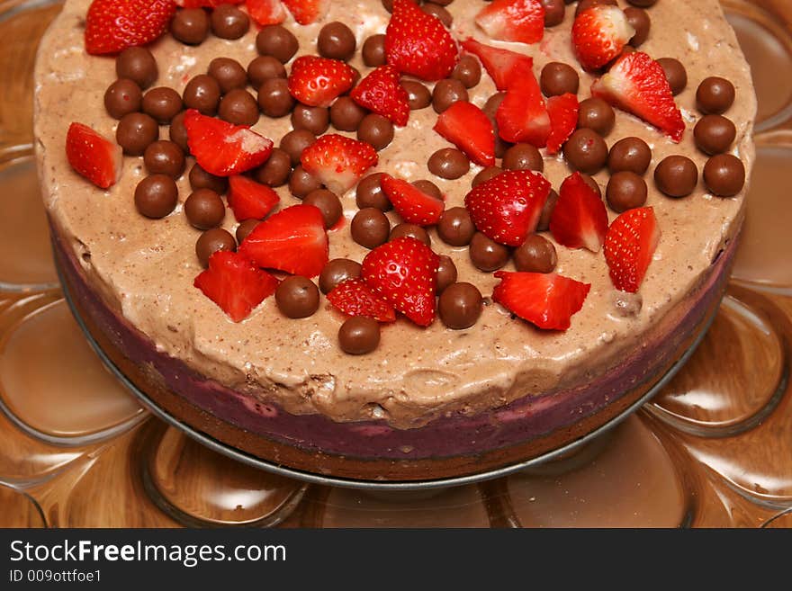 Strawberry icecake on a cakeplatter cropped shot. Strawberry icecake on a cakeplatter cropped shot