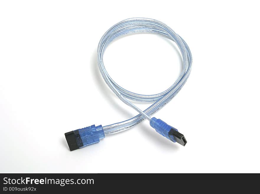 Computer wire with blue ends placed on the white backdrop. Computer wire with blue ends placed on the white backdrop