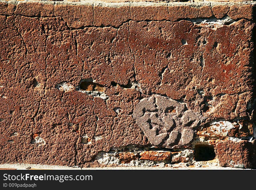 Red brick wall in sunshine - landscape format