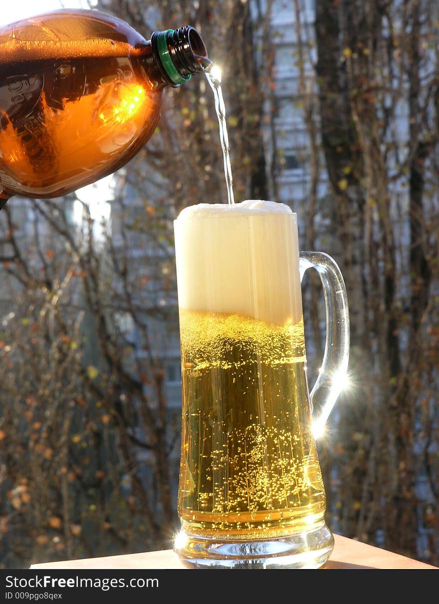 A huge glass of beer on outdoor. A huge glass of beer on outdoor