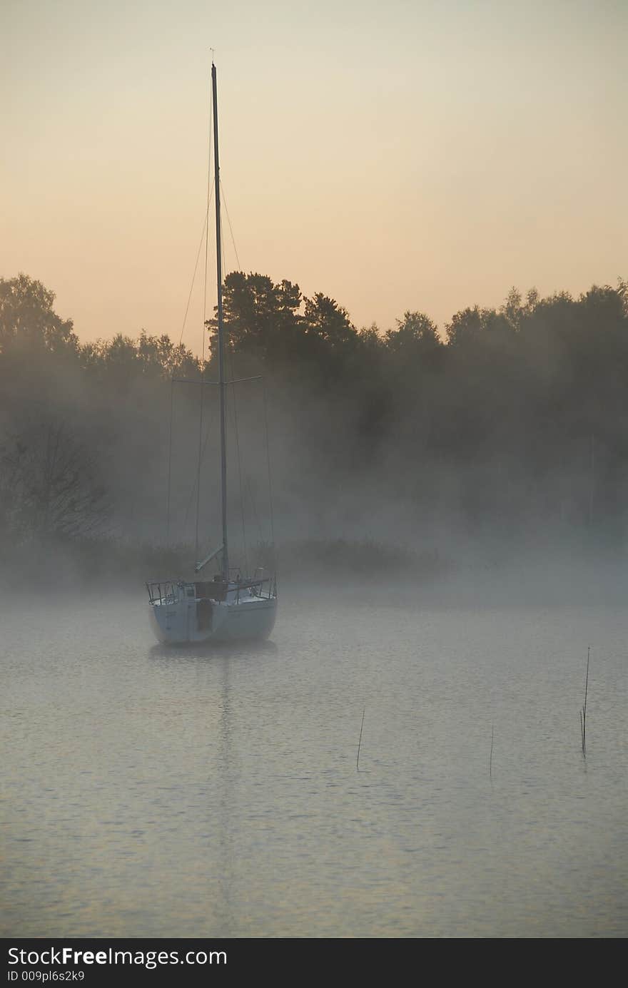 Fishing boat leaving in dawn