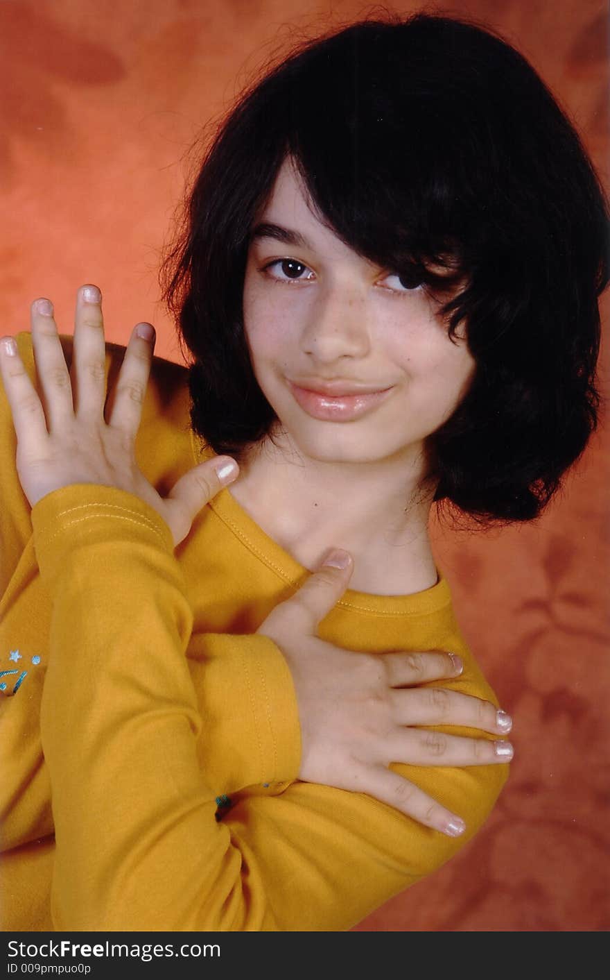 Girl with black hair and yellow shirt. Girl with black hair and yellow shirt