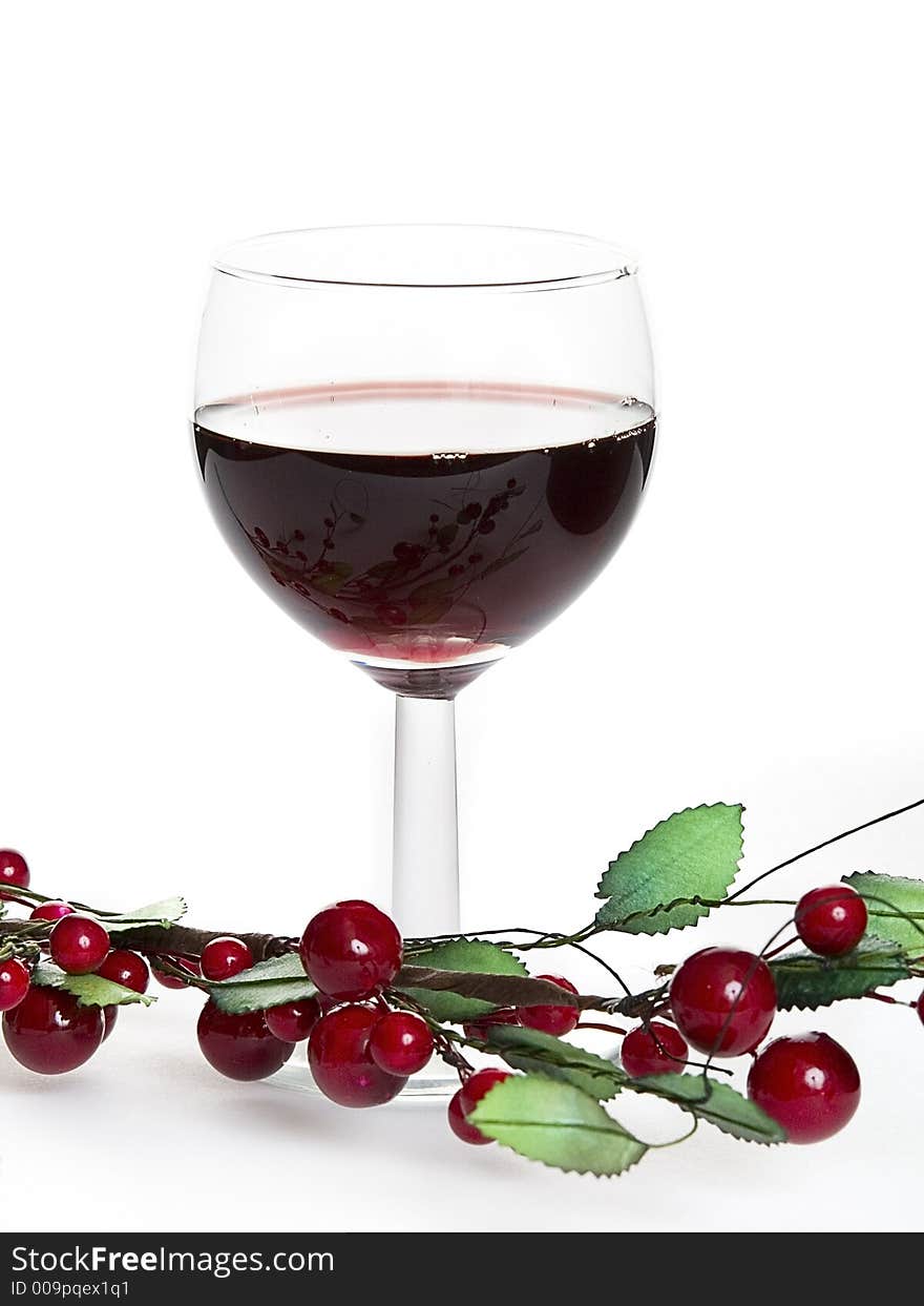 Glass of red wine witch cherry