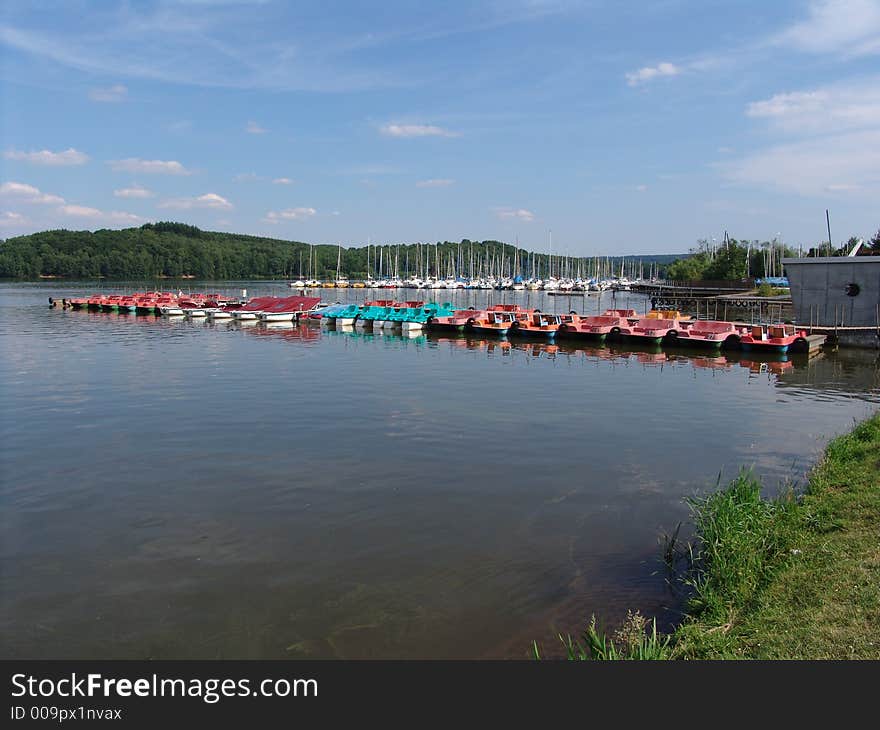 A landscape view of the Botsalsee on a hot July day in Germany. The Botsalsee is the largest lake in the Rheinland Pfalz area of Germany and very popular. A landscape view of the Botsalsee on a hot July day in Germany. The Botsalsee is the largest lake in the Rheinland Pfalz area of Germany and very popular.