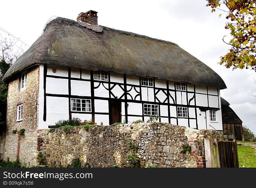 Thatched Timber Framed Cottage in a Rural Village in England. Thatched Timber Framed Cottage in a Rural Village in England