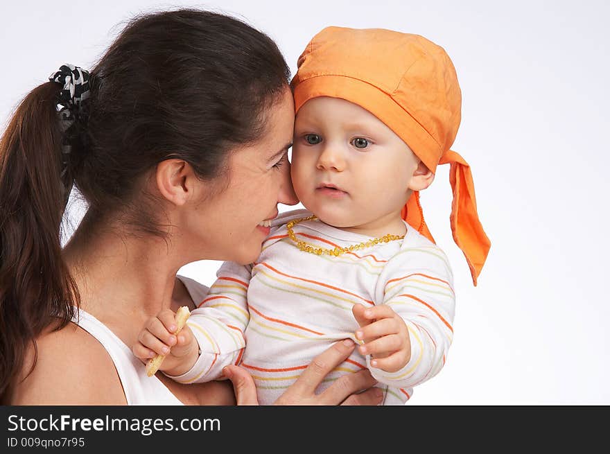 Mother is holding her young boy in her arms. Mother is holding her young boy in her arms