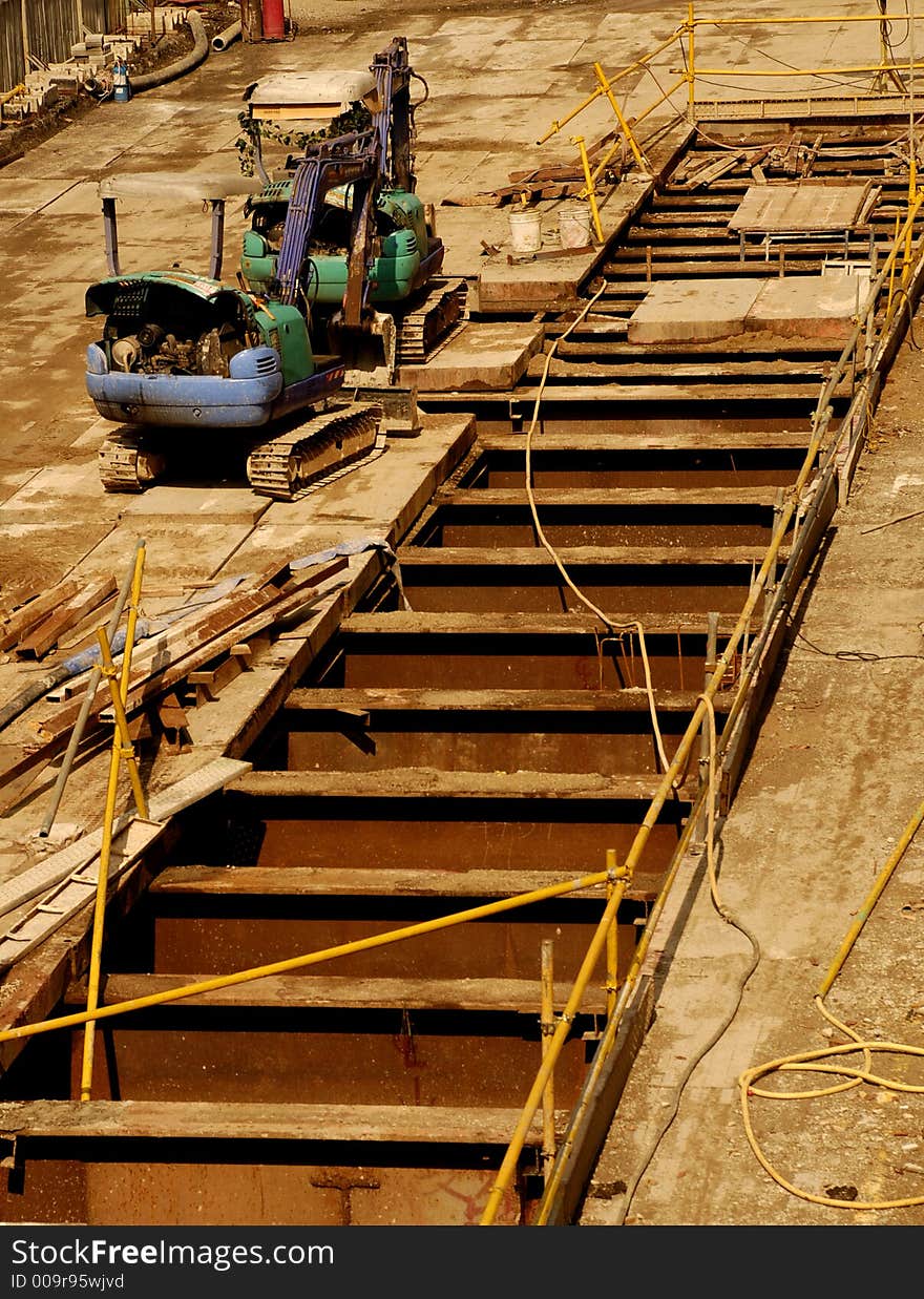 Two excavators resting at the construction site