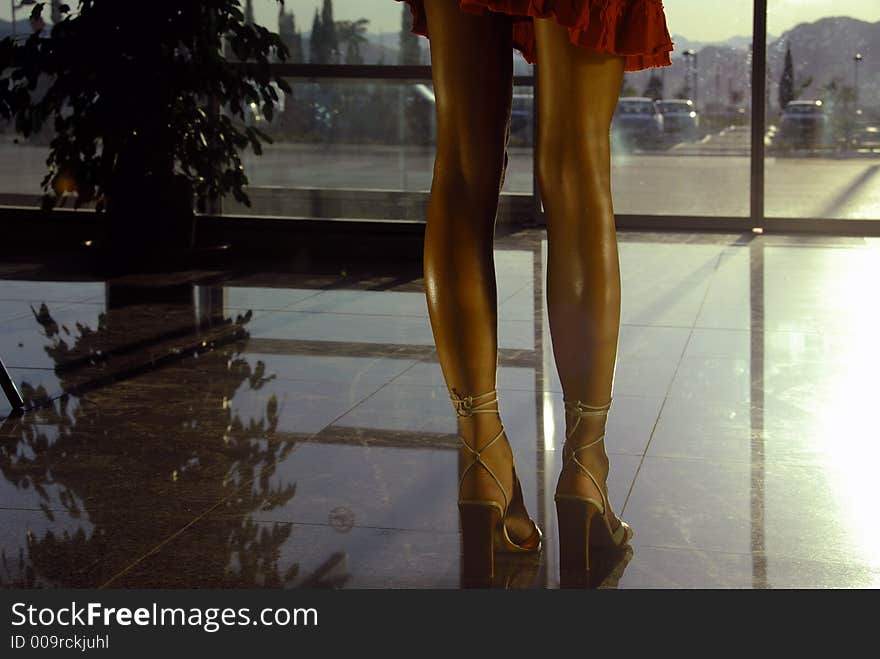 Woman legs at the airport