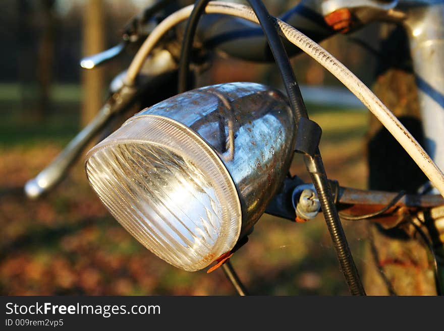 Corroded lamp on a very old bicycle. I wonder if it's still working . Corroded lamp on a very old bicycle. I wonder if it's still working ...