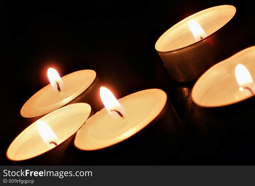 A candles over black background