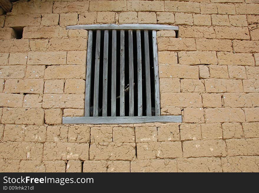 Mud brick wall with window  in China. Mud brick wall with window  in China