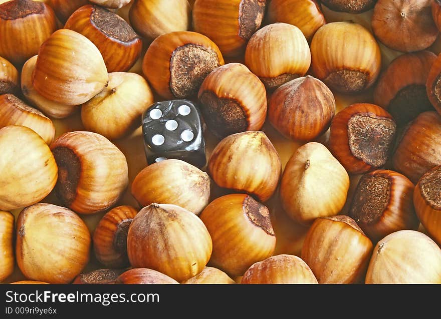 Nuts and dice abstract background