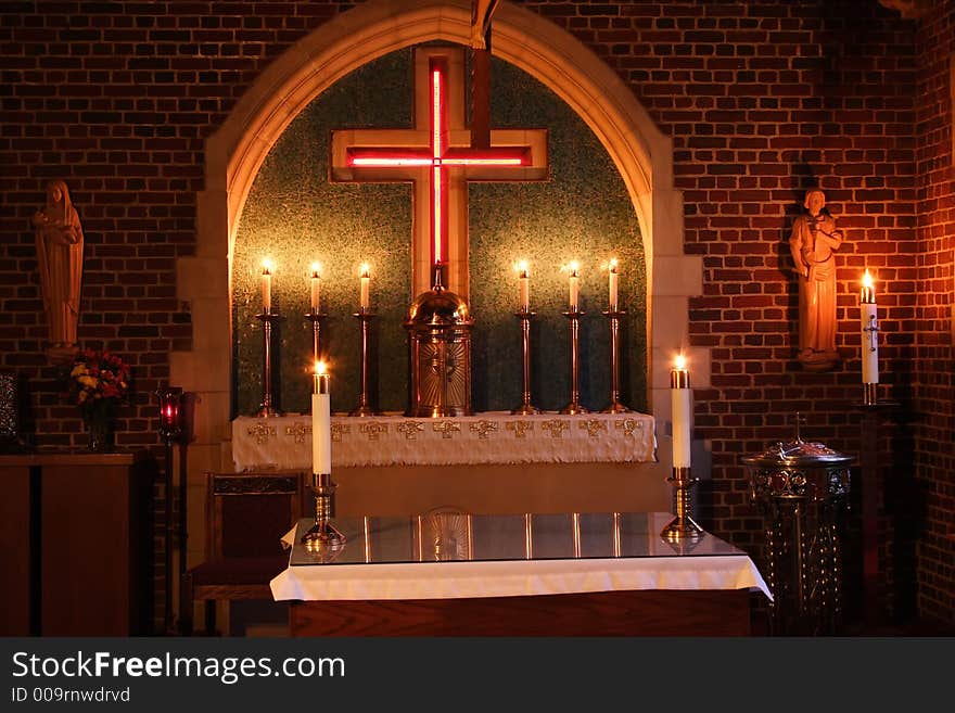 Small sanctuary lit with candles. Small sanctuary lit with candles