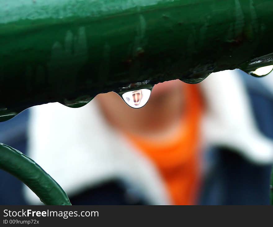 A boy reflecting in a drop. A boy reflecting in a drop.