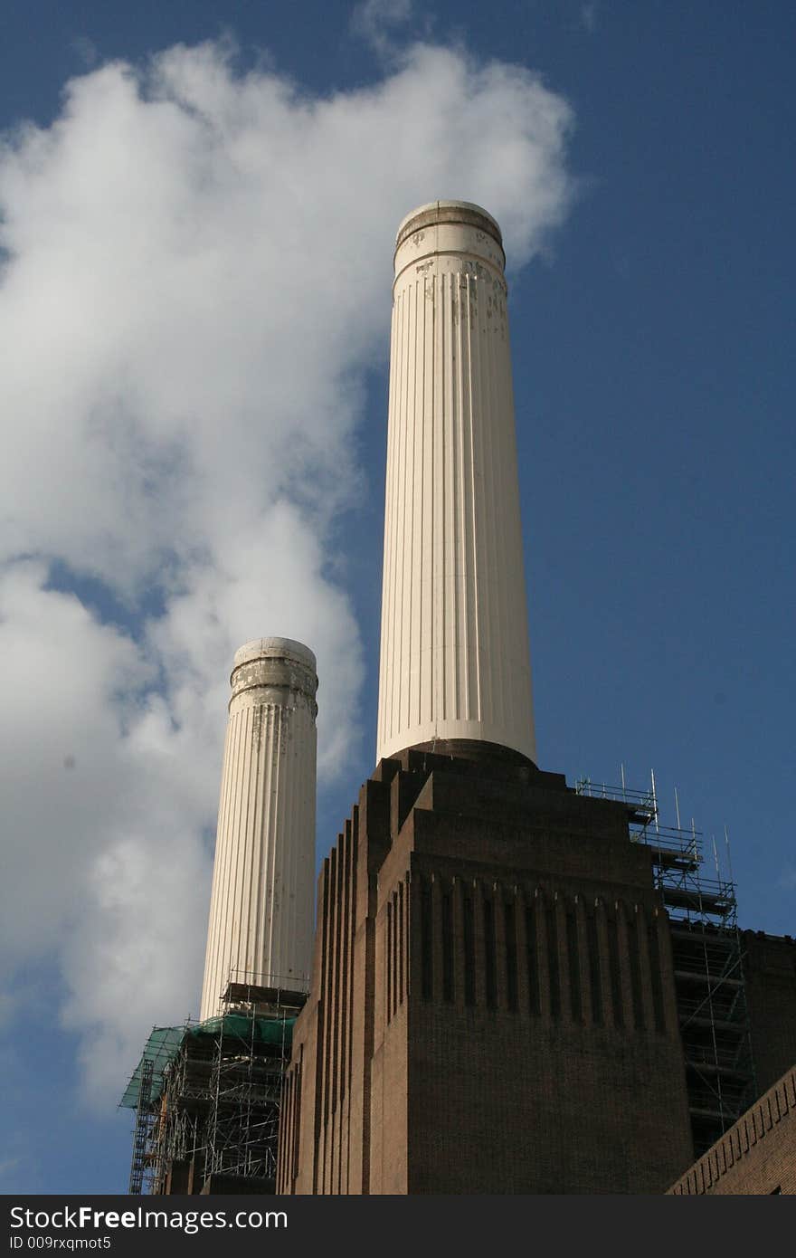 Inside Battersea Power Station, London, Energy, Architecture, coal, Sir Giles Gilbert Scott, 1929, 1939, Parkview International. The'smoke' is actually formed by passing clouds