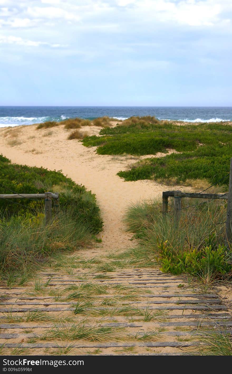 Wooden pathway over sand to preserve coastal sand dune and environment. Wooden pathway over sand to preserve coastal sand dune and environment