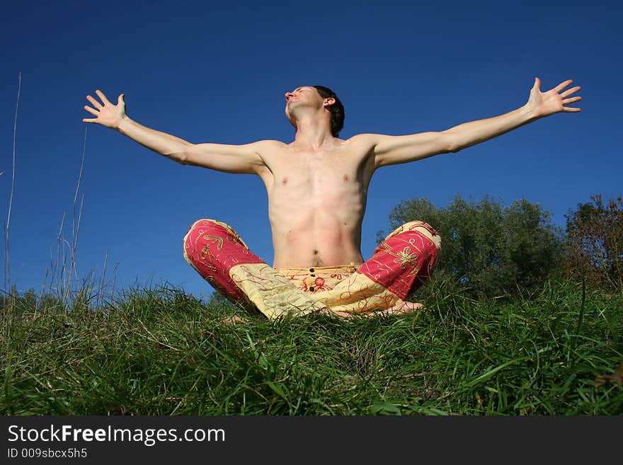 Man experiencing bliss on a blue summer sky