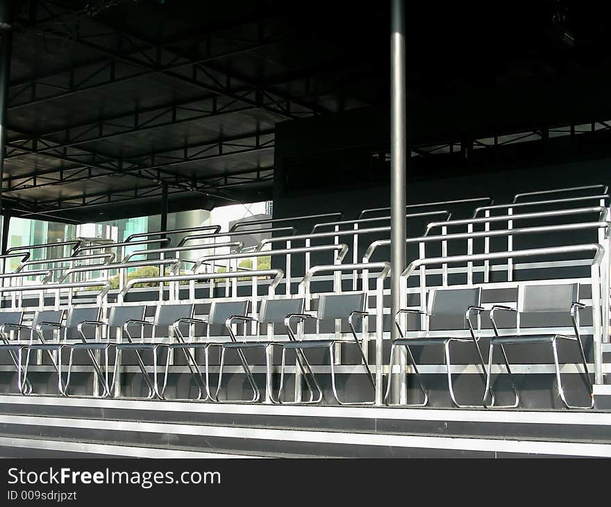 Empty seats in the audience area at an outdoor. Empty seats in the audience area at an outdoor