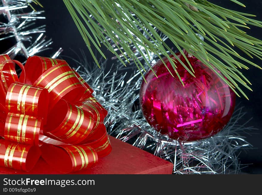 Gift box, christmas ball and tinsel