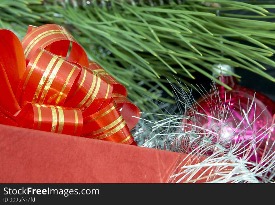 Gift box, christmas ball and silver tinsel