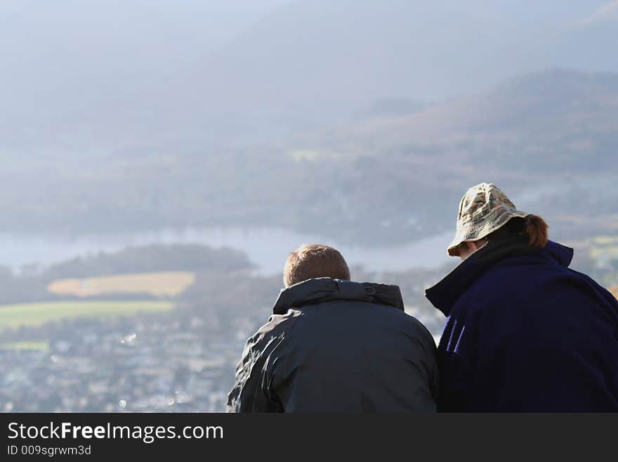 Couple looking out over the English Lakes. Couple looking out over the English Lakes