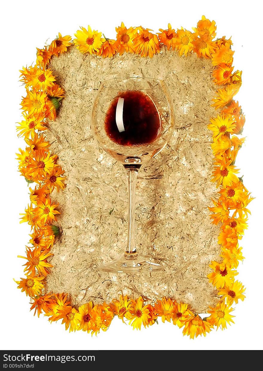 Glass of wine spangled with yellow flowers. Glass of wine spangled with yellow flowers