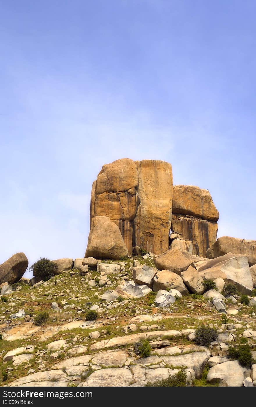 Low angle view of rock formations on top of a hill