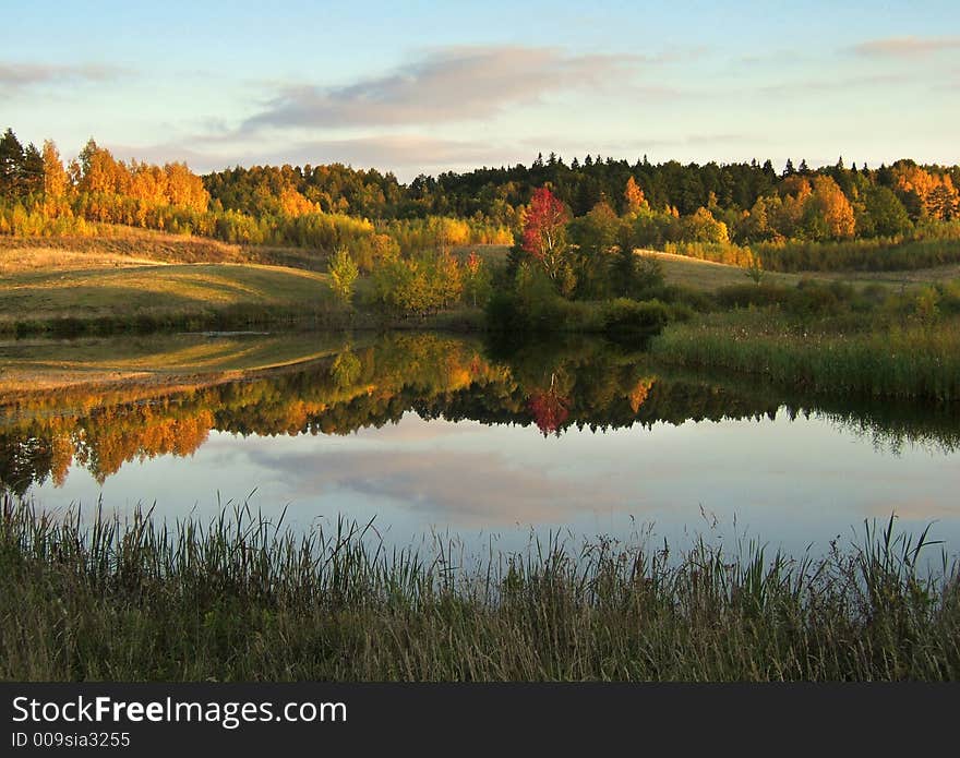 Colorful autumn landscape with lake