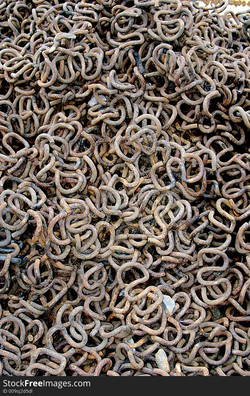 A heap of scrap-iron is resting after the maintenance of the railway. A heap of scrap-iron is resting after the maintenance of the railway.