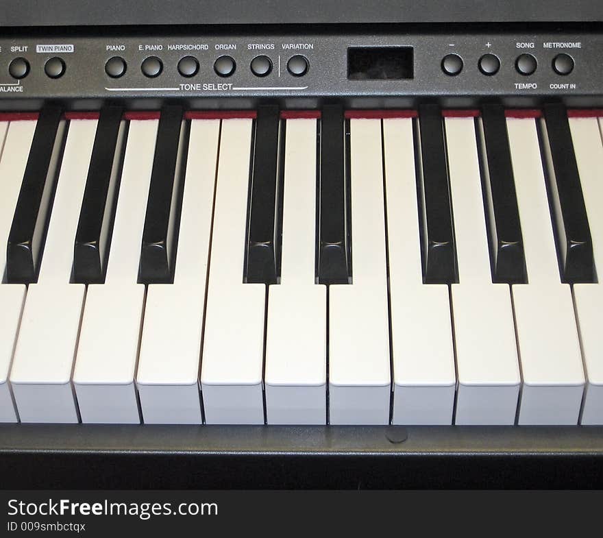 Close-Up of Electronic Piano Keyboard and Controls