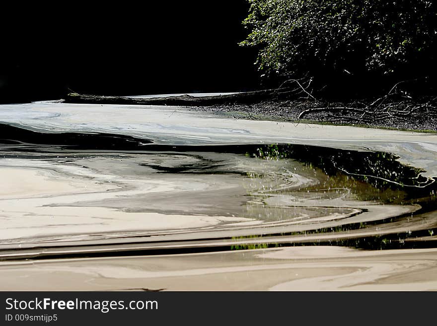 It is summer and the pool in the forest of Voorstonden in the neighbourhood of Zutphen (the Netherlands) is drying up. A beautiful structure is visible. It is summer and the pool in the forest of Voorstonden in the neighbourhood of Zutphen (the Netherlands) is drying up. A beautiful structure is visible.