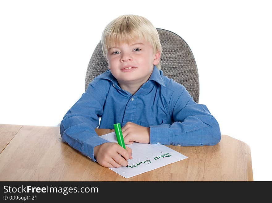 Young boy writing letter to Santa. Young boy writing letter to Santa