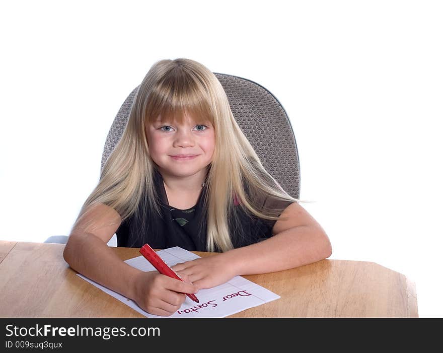 Young girl writing letter to Santa. Young girl writing letter to Santa