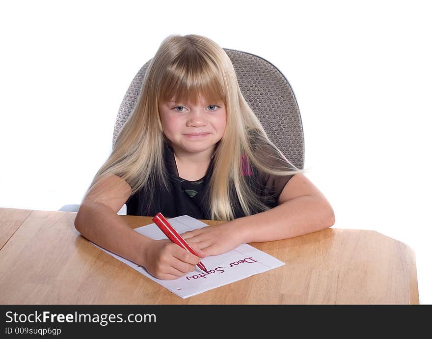 Young girl writing letter to Santa. Young girl writing letter to Santa