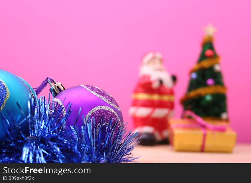 Christmas Ornaments on Pink Background. Shallow DOF