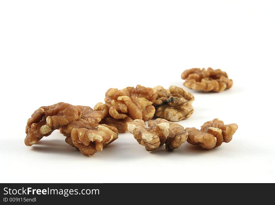 Walnuts against a white background