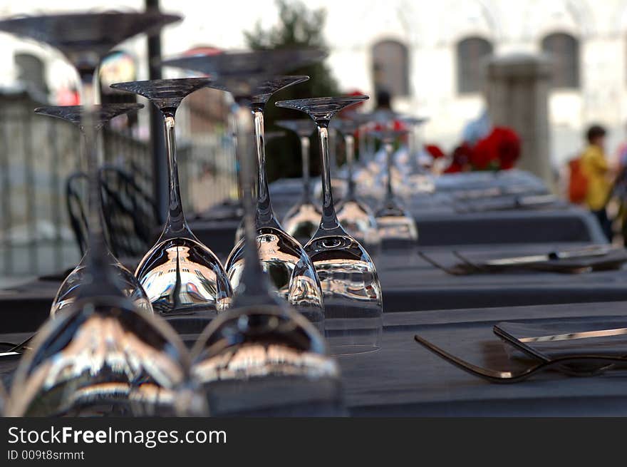 Some glasses are on the table in the restaurant