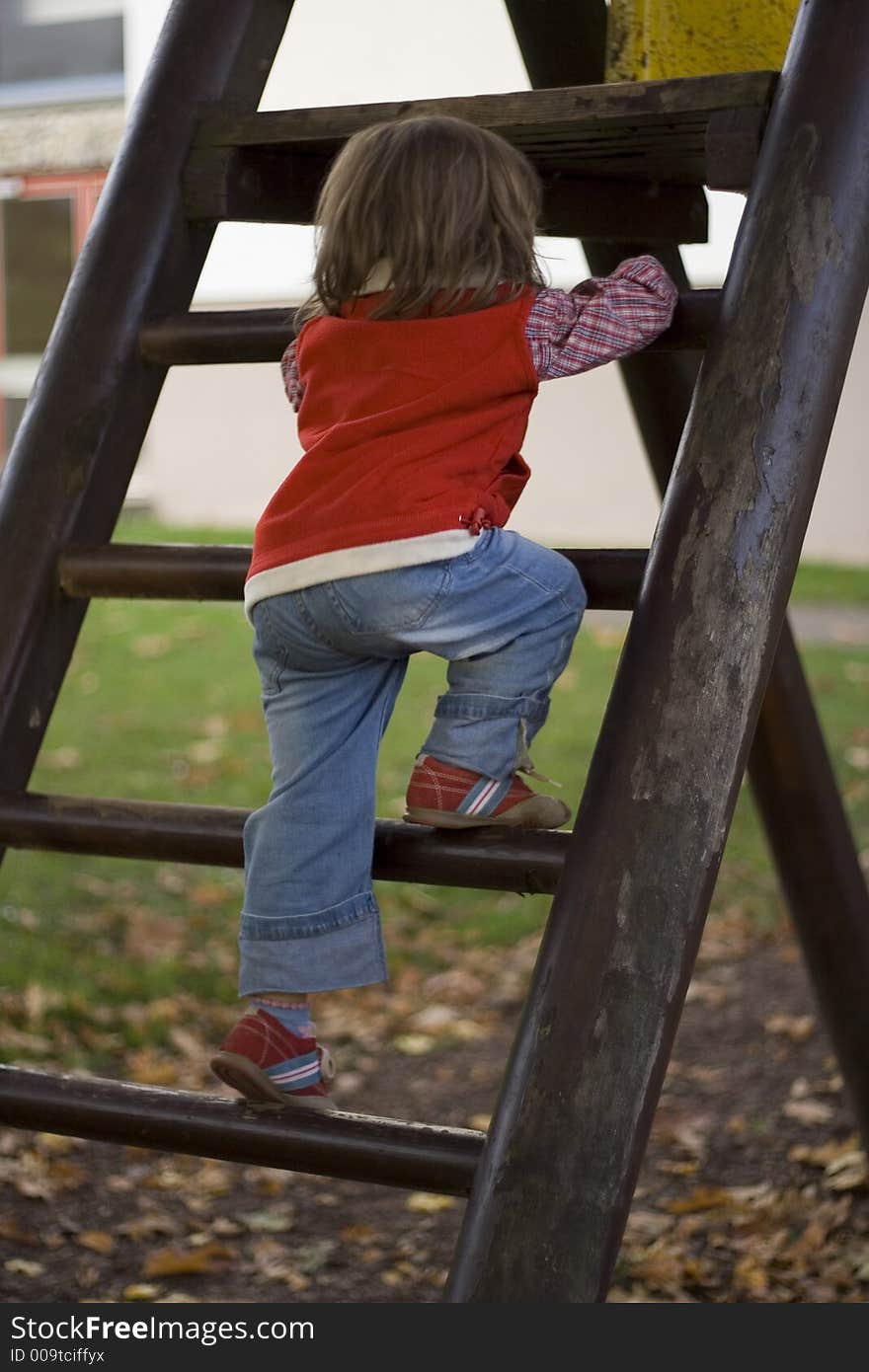 Little girl playing at the playground. Little girl playing at the playground